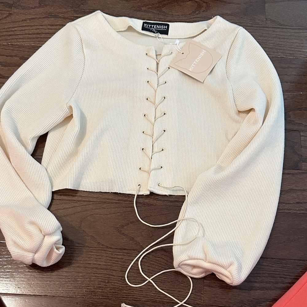 Kittenish Ivory Lace-Up sweater